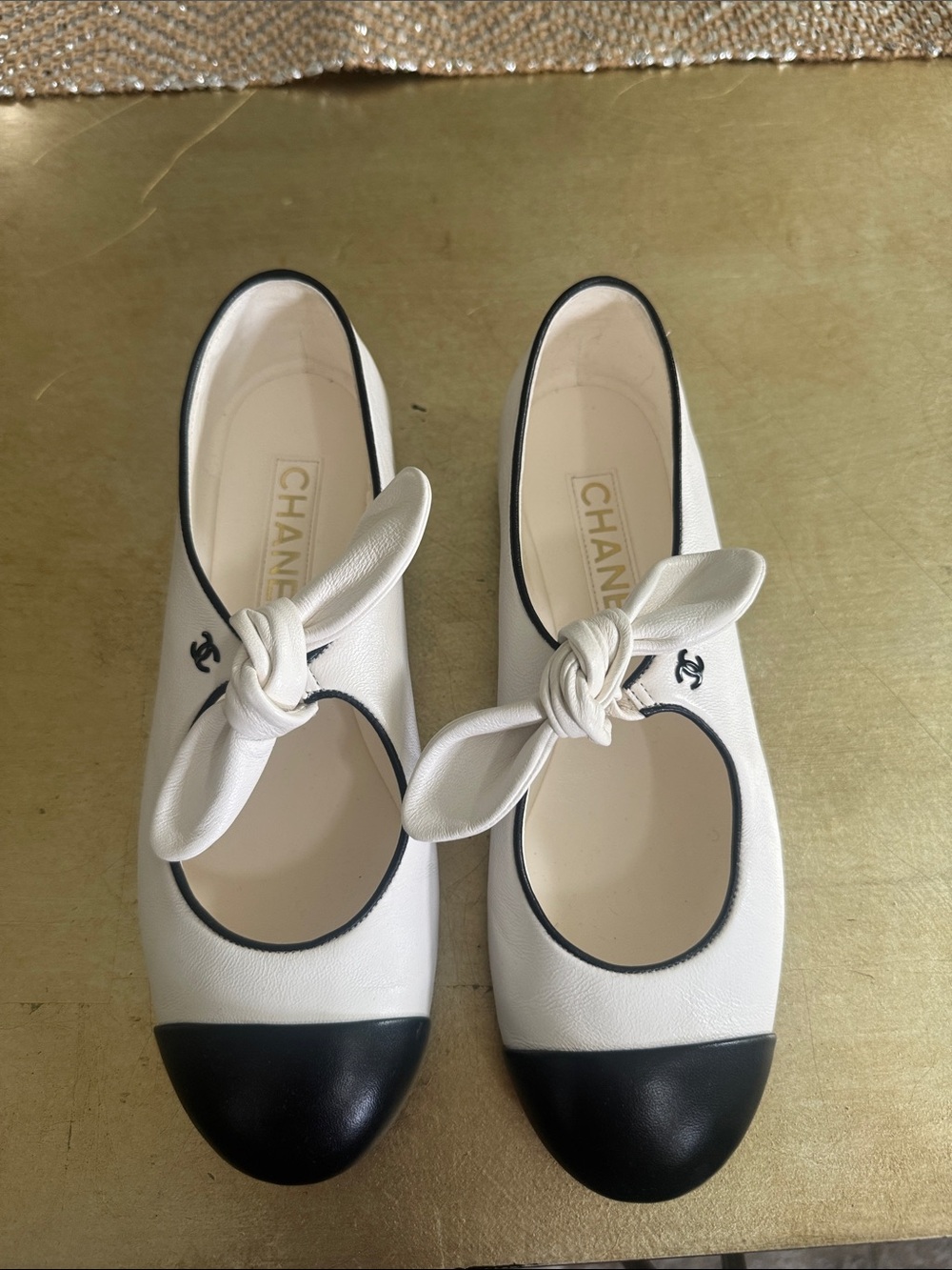 CHANEL White Leather Mary Jane Flats with Black Cap Toe and Bow